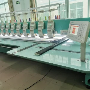 Interior view of a lace manufacturing factory showcasing advanced automated embroidery machines used for producing intricate lace patterns in bulk.
