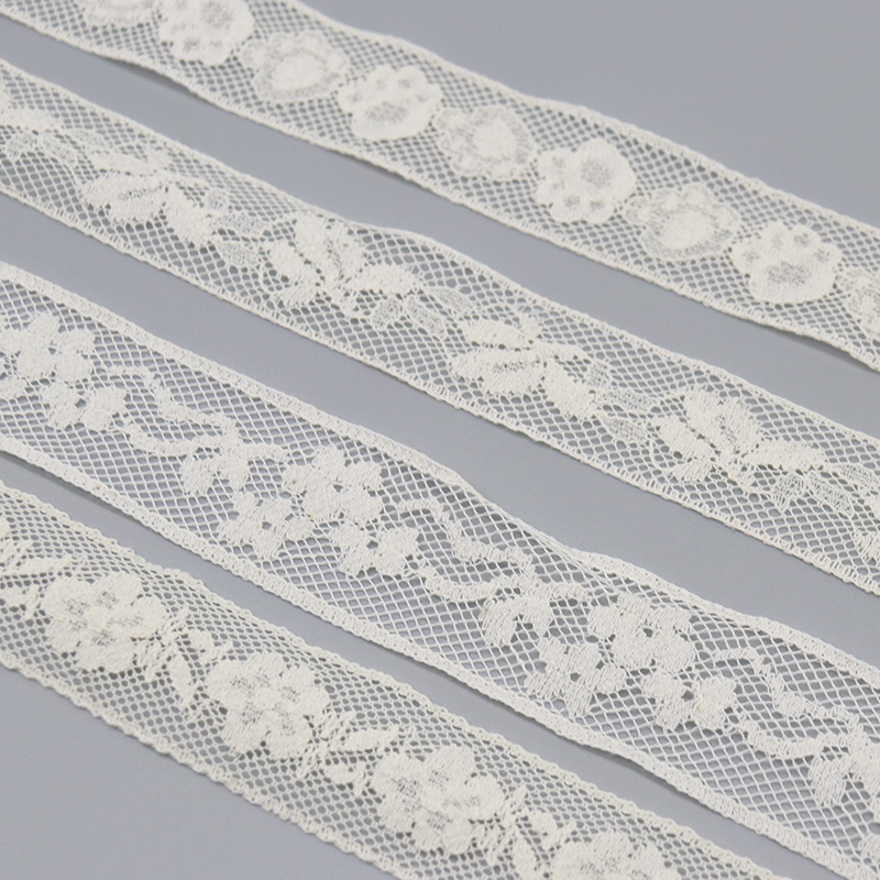 White French lace and hand-finished crochet trims shown as embellishments for custom wedding dresses and ODM bridal collections.