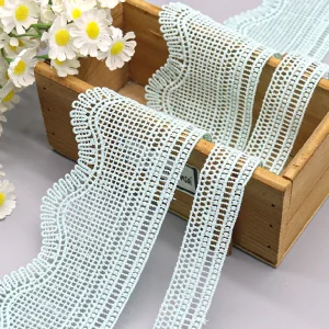 Beautiful polyester lace trim, water soluble with floral patterns, suitable for various textile crafts and clothing embellishments.