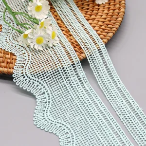 Lightweight and durable polyester water soluble lace fabric, perfect for custom dressmaking and delicate garment details.