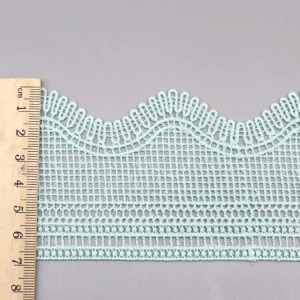 Elegant and fine polyester water soluble lace trim, designed for high-end apparel and decorative textile projects.