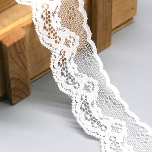 Delicate floral lace trim perfect for enhancing dresses, blouses, and other fashion garments with intricate detailing.