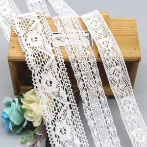 High-quality cotton thread lace trim featuring delicate floral designs, perfect for enhancing clothing, accessories, and craft projects.