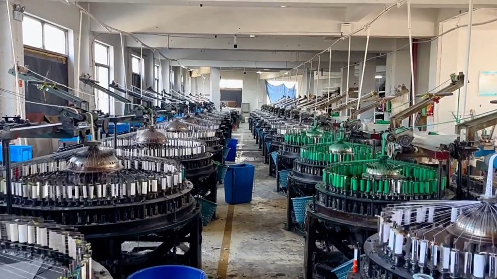 Inside view of a cotton lace factory featuring modern machinery and skilled operators producing premium cotton lace trims for fashion and home textiles.