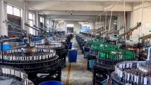 Inside view of a cotton lace factory featuring modern machinery and skilled operators producing premium cotton lace trims for fashion and home textiles.
