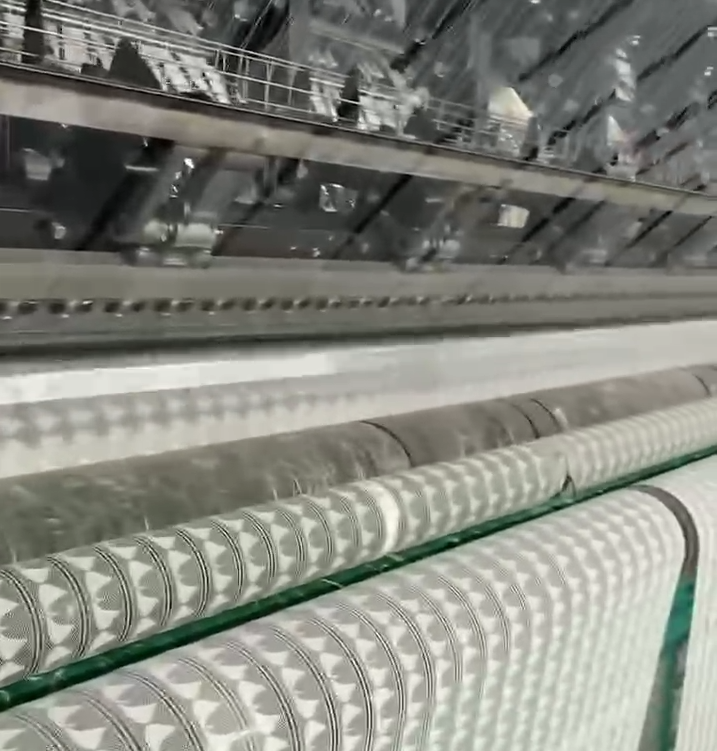 Inside view of a modern lace trim factory with automated embroidery machines producing high-quality lace fabrics efficiently.
