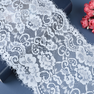 Soft ivory vintage lace in a polyester–cotton blend with Chantilly-look florals, ideal for bridal overlays and sleeve trims.