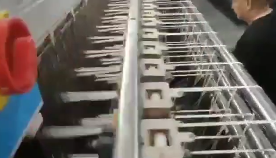 Factory floor showcasing skilled technicians and embroidery machines dedicated to high-precision production of black cotton thread lace trims.