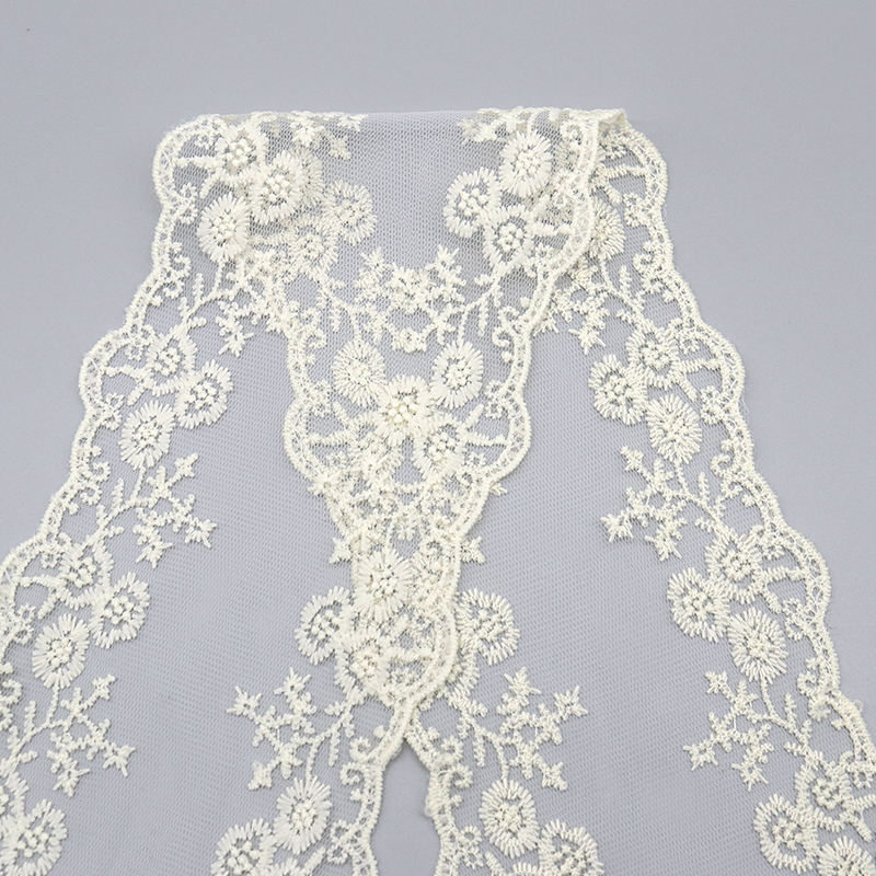 Product display showing bias piping cord lace and grosgrain ribbon lace trims side by side, contrasting rounded corded edges with flat ribbed grosgrain edges in assorted colors and widths for private-label garments.
