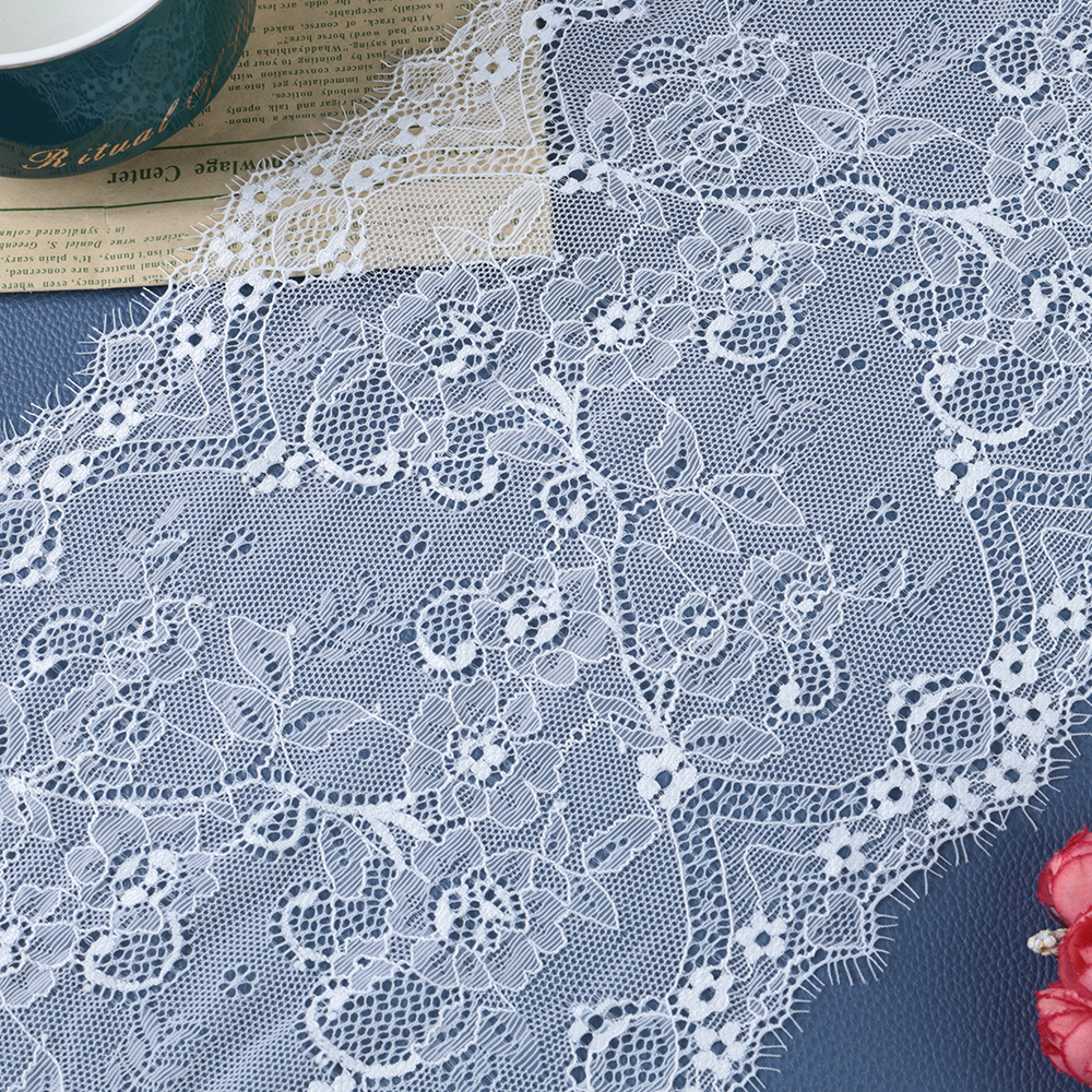 Delicate floral lace trim with intricate patterns, perfect for enhancing garments, dresses, and fashion accessories.