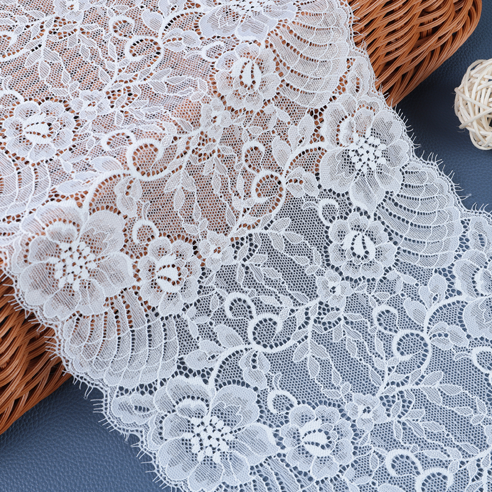 Ecru polyester–cotton vintage lace fabric with retro texture and delicate borders, perfect for DIY sewing and craft embellishments.