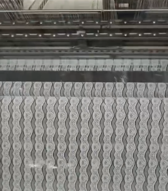 Factory specializing in wholesale lace production offering custom design services and fast turnaround times to meet client demands.