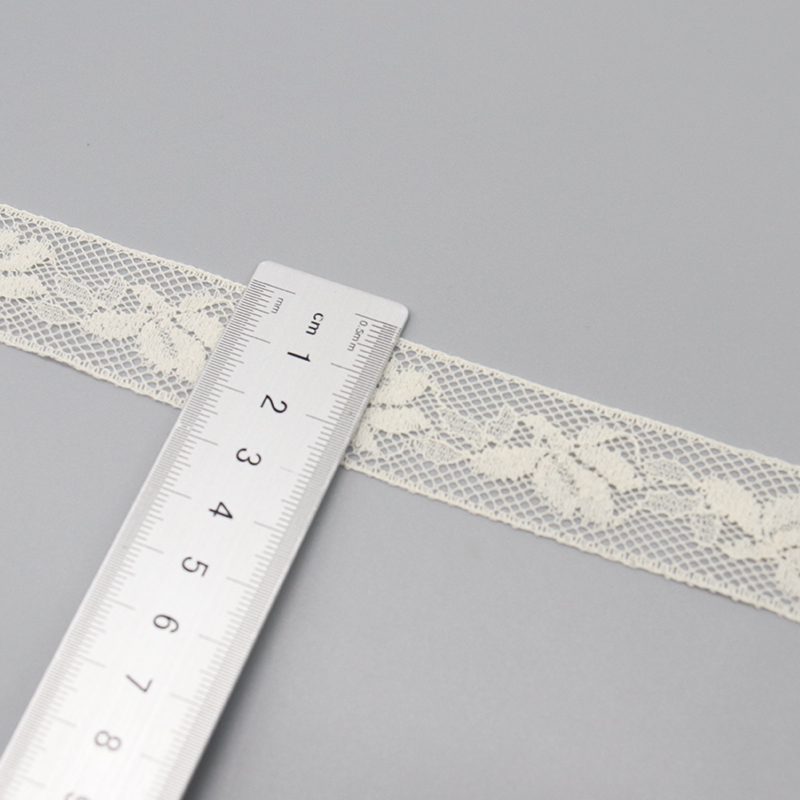 White fancy lace trim with smooth, sophisticated finish versus chunky vintage crochet lace, both shown enhancing ceremony archways in ODM wedding designs.