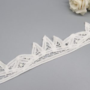 White 100% pure cotton eyelet lace with reinforced border stitching, perfect for dressmaking, baby clothes, and home textiles.