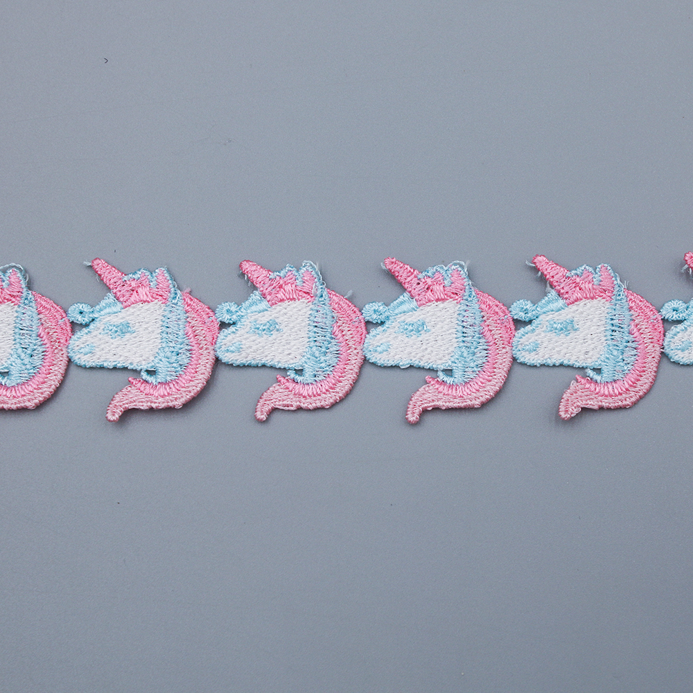 Selection of water soluble lace featuring ombre gradients, bold solid tones, and undyed white versions for unique garment accents.