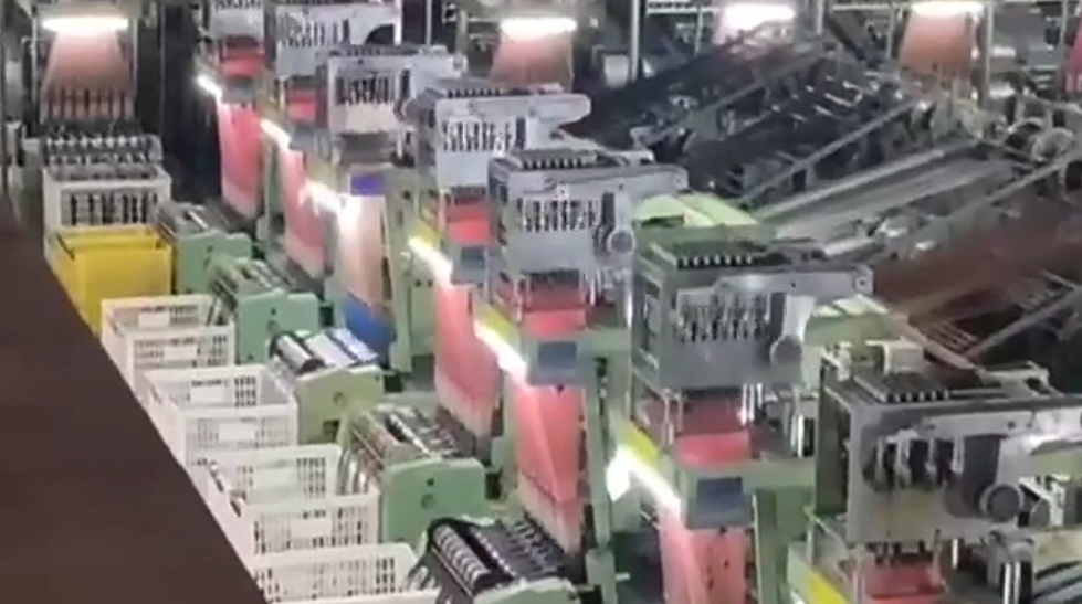 Large-scale production factory equipped for bulk orders of black and red cotton thread lace, with integrated quality assurance and modern equipment.