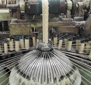 Interior view of a state-of-the-art cotton thread lace factory using automated embroidery systems for precise lace production. 