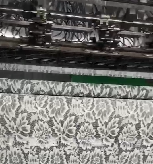 Spacious lace production plant featuring digital jacquard systems and strict quality control stations, supporting custom designs and fast turnaround.