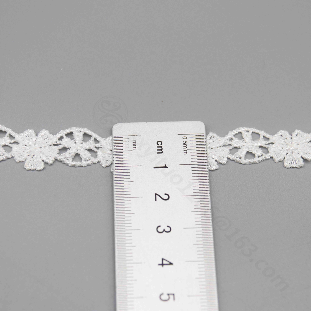 Artistic close-up of a fine water-soluble lace trim