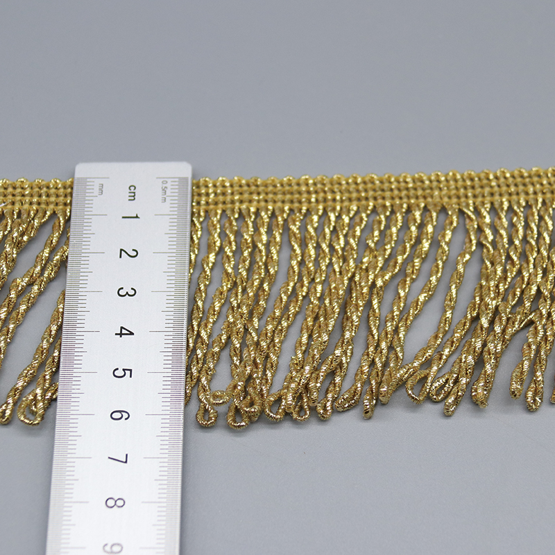 Detail of the straight woven header band and looped fringe strand attachment