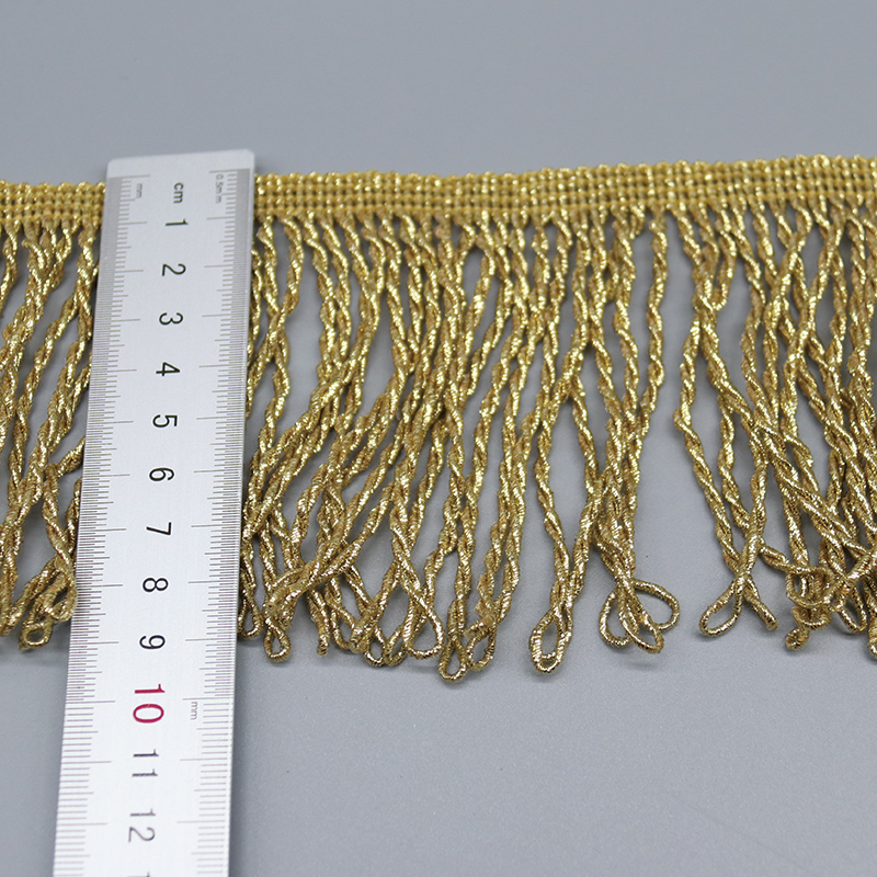 Macro shot of golden spiral twisted metallic thread details