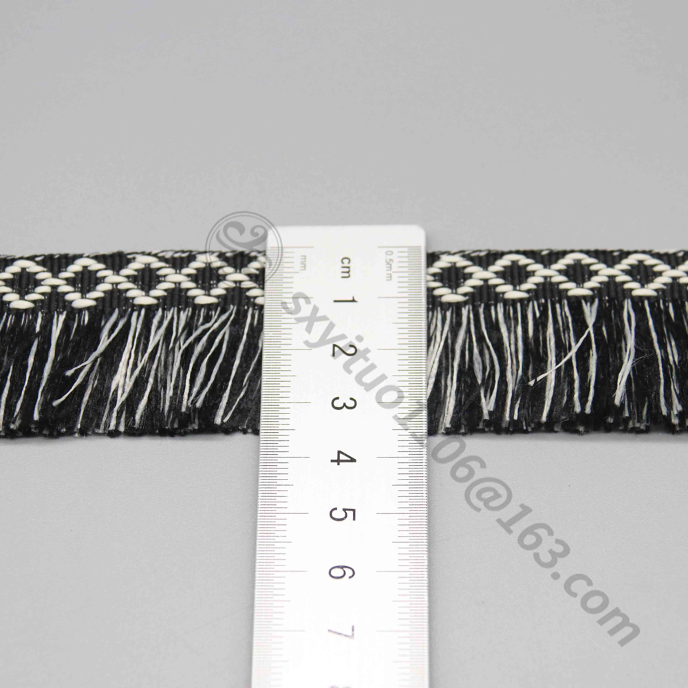 Ruler laid vertically across the fringe trim showing the exact 3.5cm width measurement.