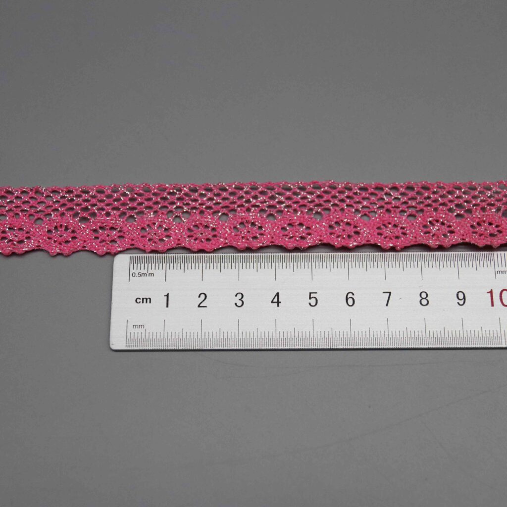 Ruler laid horizontally along the floral pattern repeat showing motif spacing