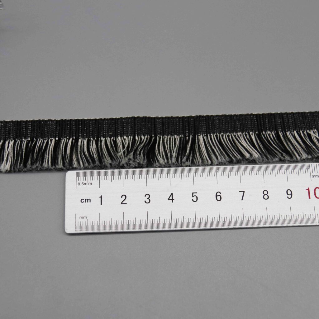 Ruler laid horizontally along the header band showing strand density and distribution