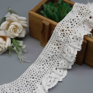 Front-facing shot showing the gathered ruffle texture and openwork mesh pattern clearly.