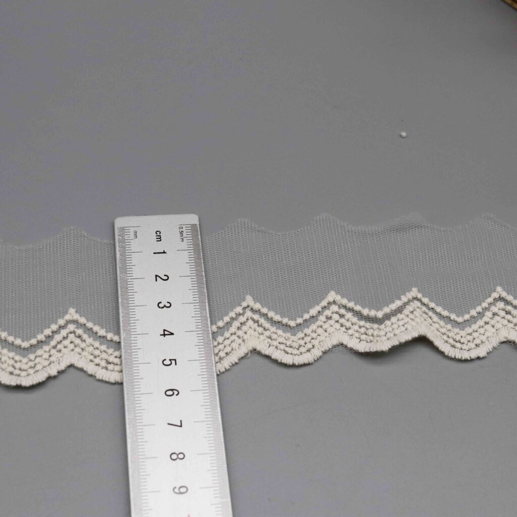 Ruler laid horizontally along the chevron wave pattern repeat showing zigzag spacing