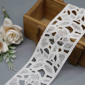 Front-facing shot showing the curved openwork pattern and smooth milk fiber texture clearly.