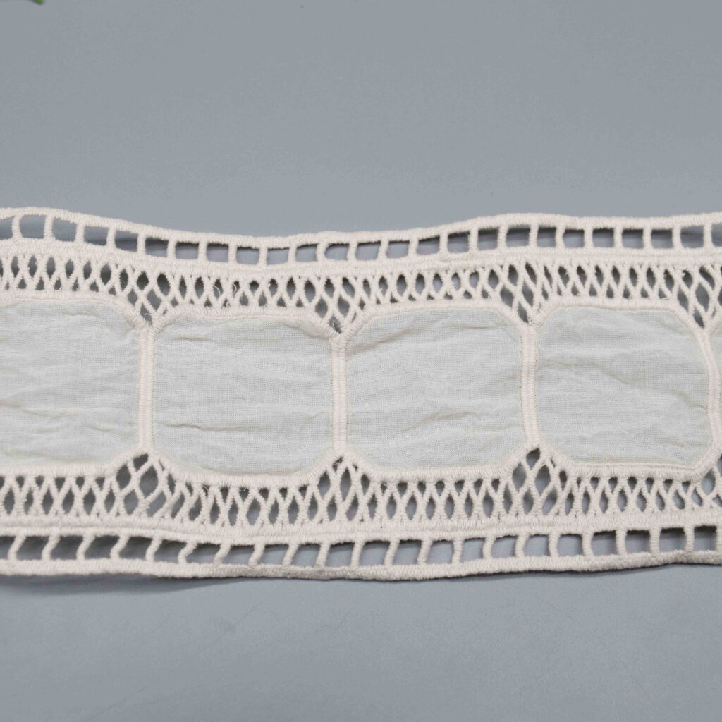 Angled view highlighting sheer panel finish and crisp tactile sensation of pure cotton textile