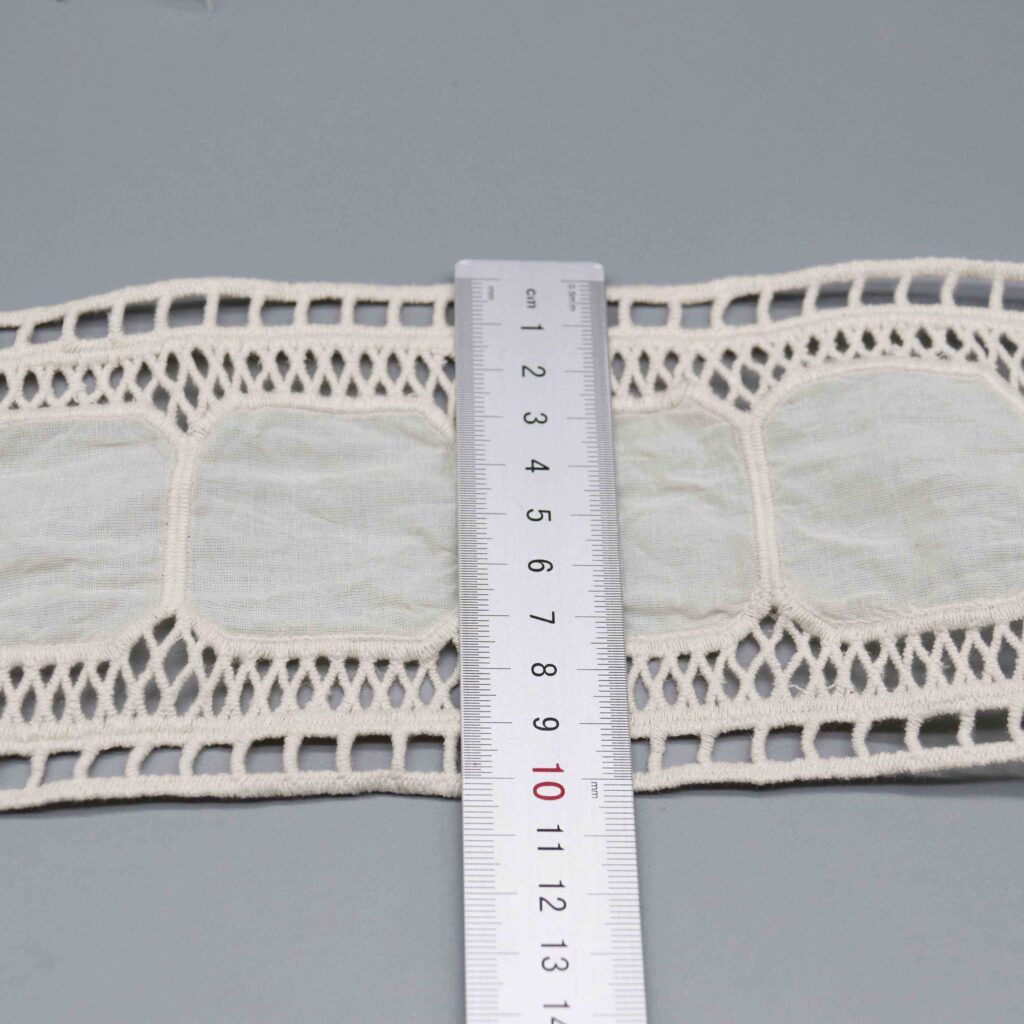 Vertical sizing gauge displaying exact 10.3cm dimension of wide insertion ribbon