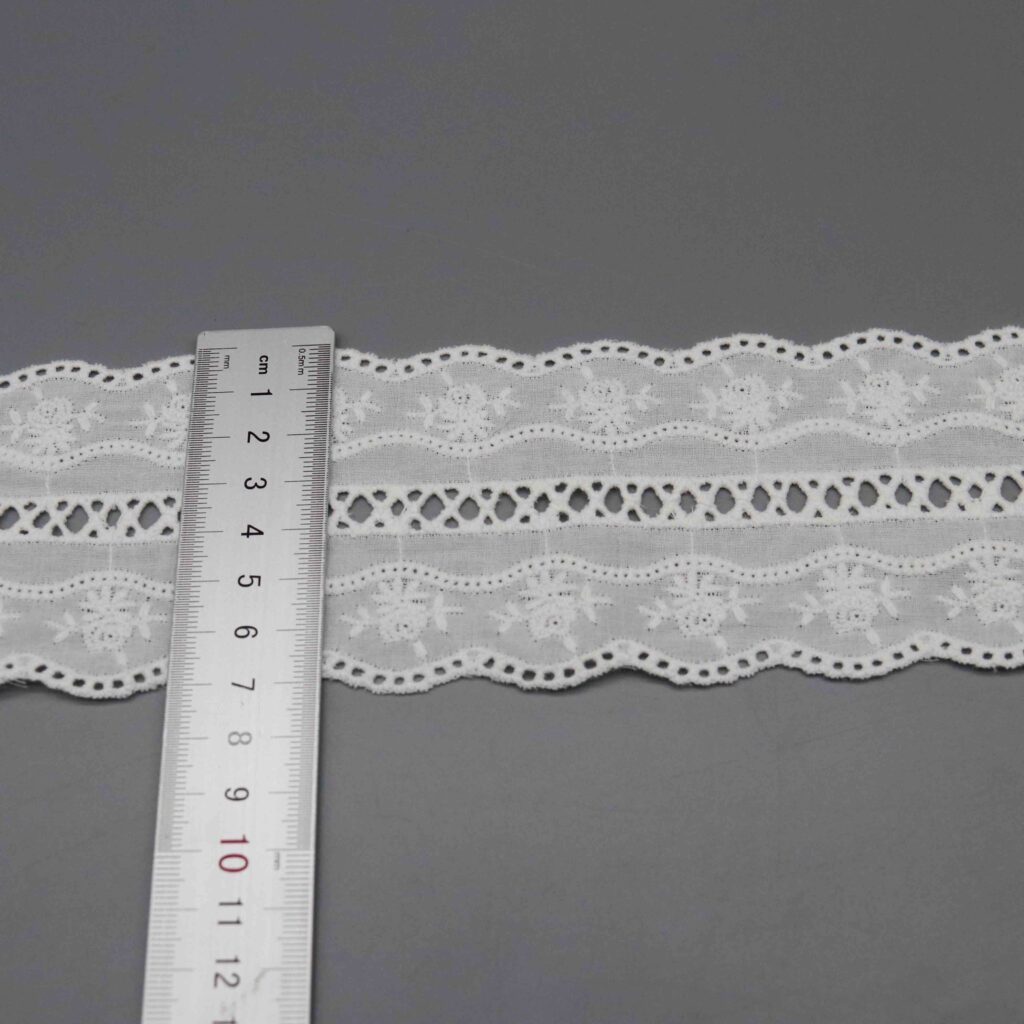 Vertical sizing gauge displaying exact 7.3cm dimension of decorative ribbon