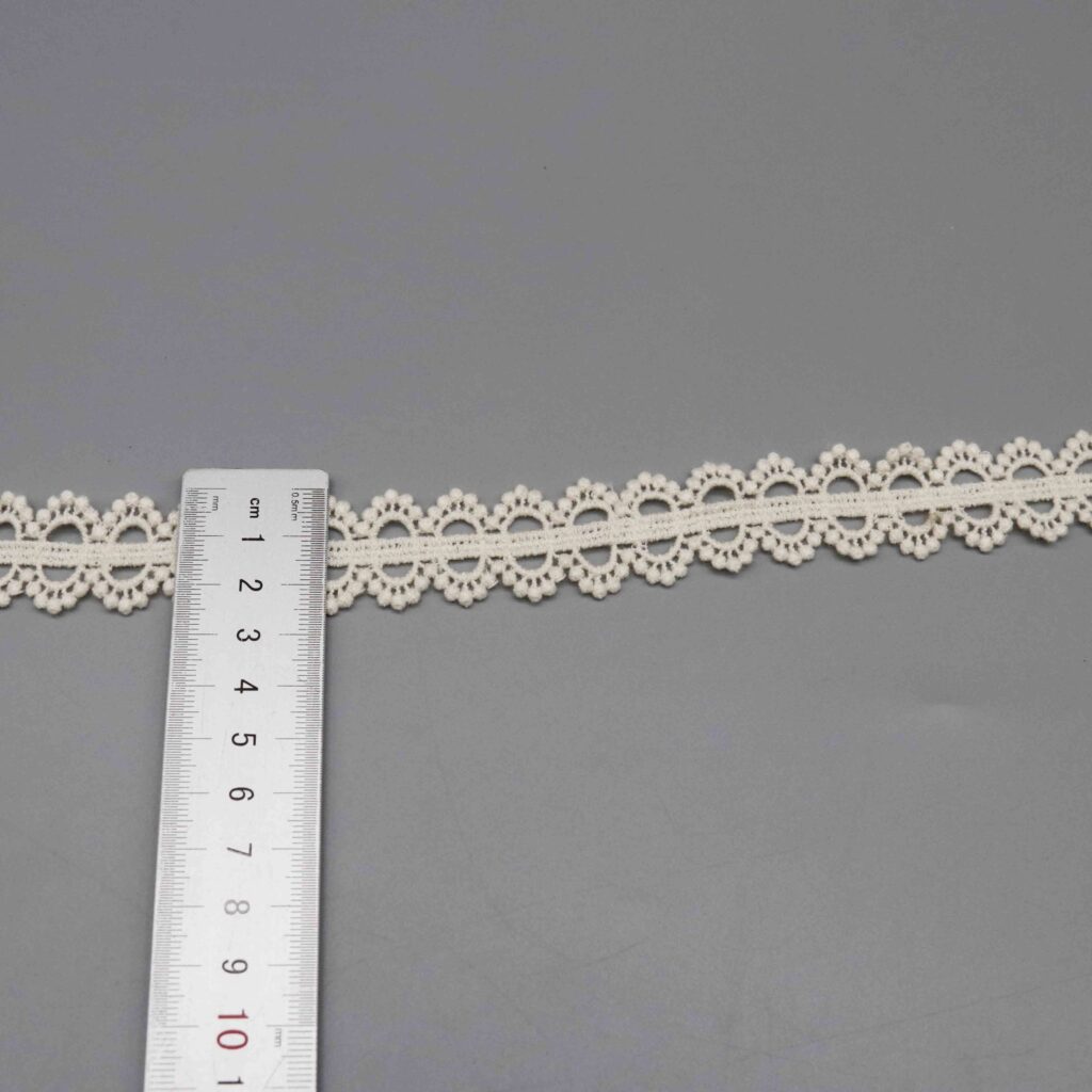 Horizontal ruler placement illustrating spacing and scale of daisy motif design cycle