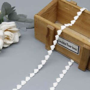 Front-facing shot showing adorable connected heart motifs and soft natural cotton texture on white water-soluble lace.