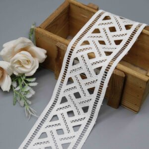 High-resolution focus on the flowing border construction and ladder-stitch hemline quality.