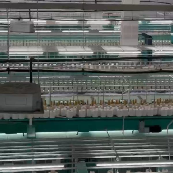 Interior view of a water soluble lace factory showcasing cutting-edge machinery and automated production lines for high-quality soluble lace manufacturing.