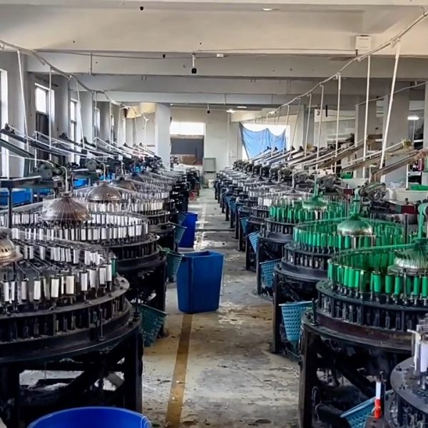 Inside view of a cotton lace factory featuring modern machinery and skilled operators producing premium cotton lace trims for fashion and home textiles.