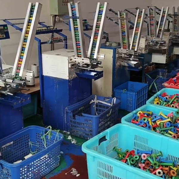 Innovative workshop specializing in cotton thread lace production, featuring advanced textile machinery and quality control processes.